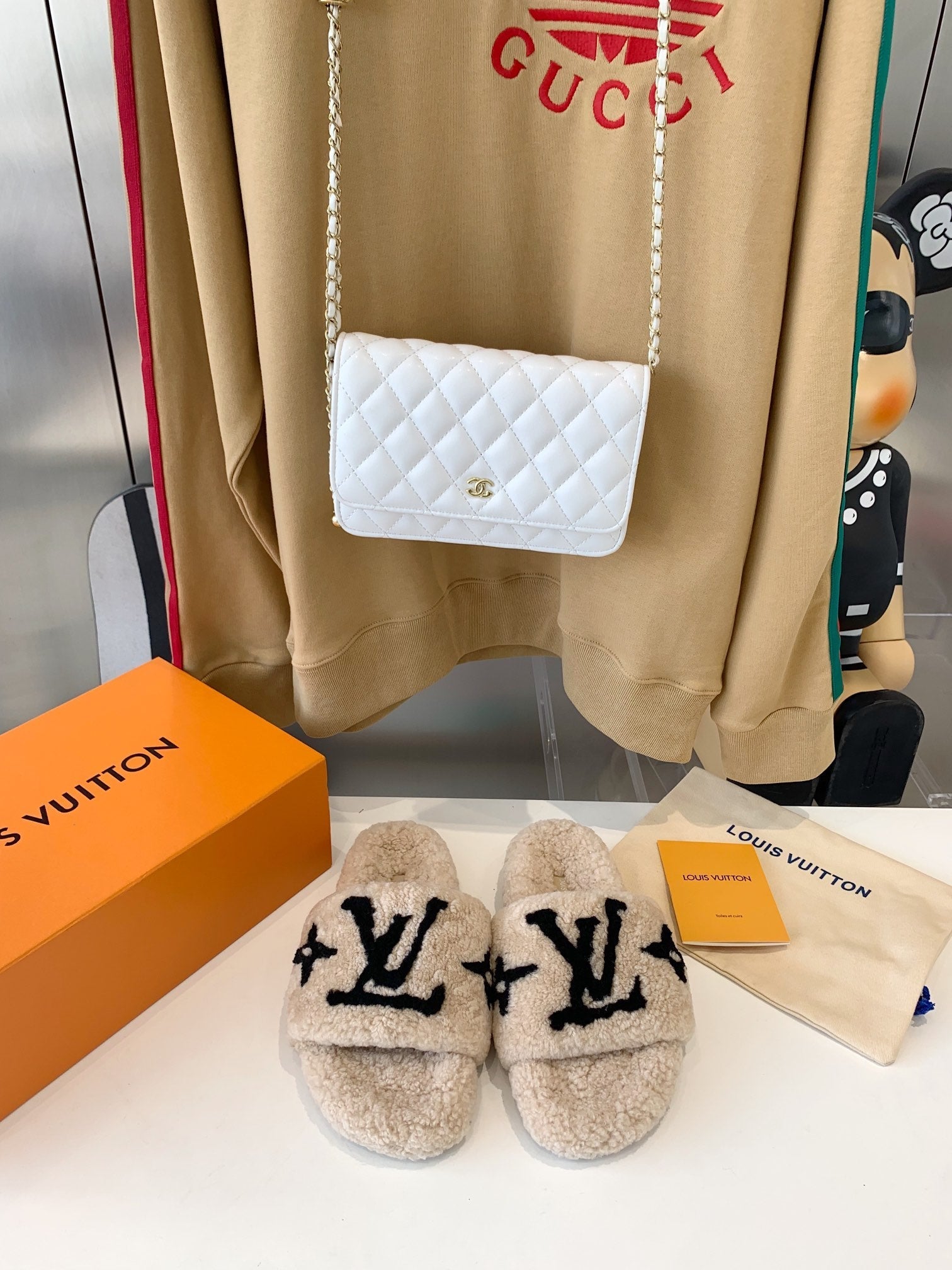 LOUIS VUITTON LV WOMEN'S PASEO FLAT SLIPPER IN TAN BROWN FLEECE WITH BLACK LOGO
