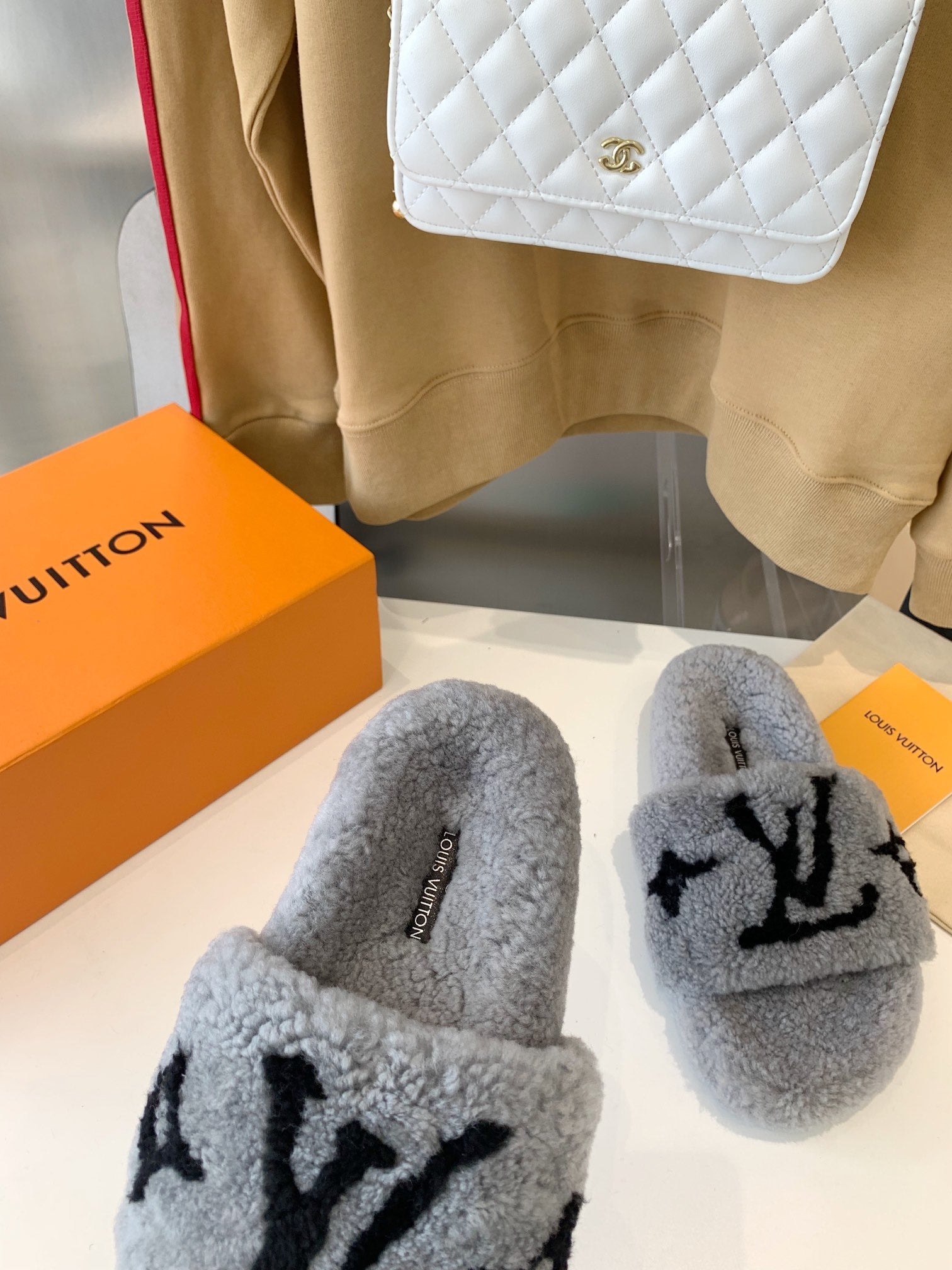 LOUIS VUITTON LV WOMEN'S PASEO FLAT SLIPPER IN GREY FLEECE WITH BLACK LOGO