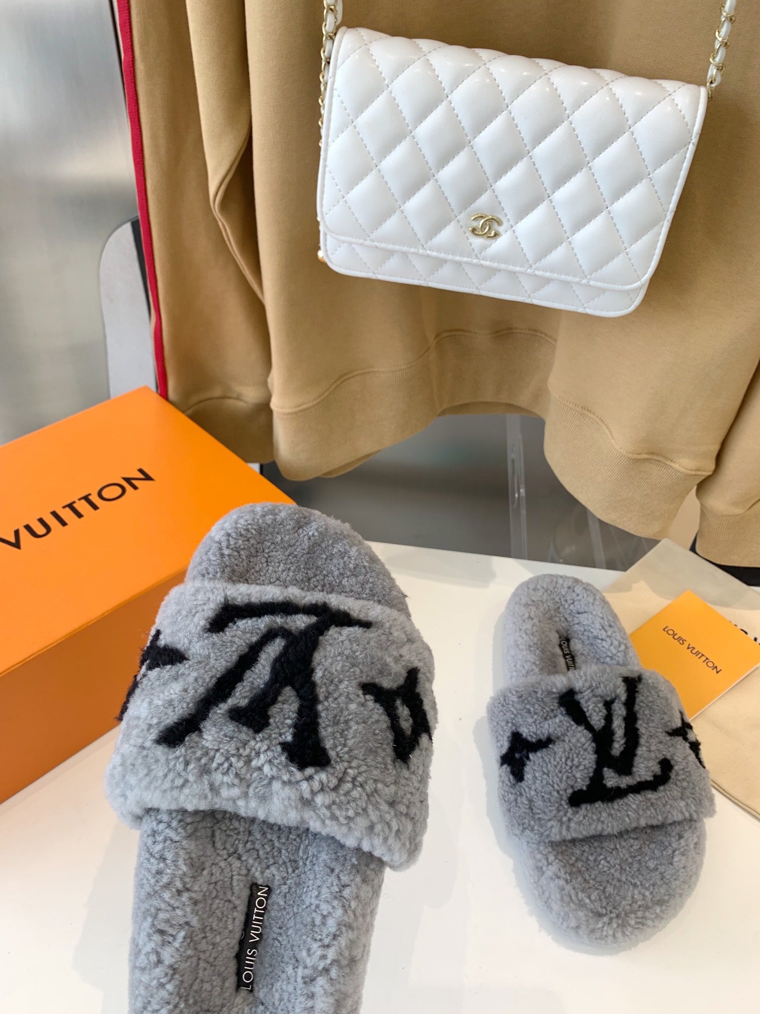 LOUIS VUITTON LV WOMEN'S PASEO FLAT SLIPPER IN GREY FLEECE WITH BLACK LOGO
