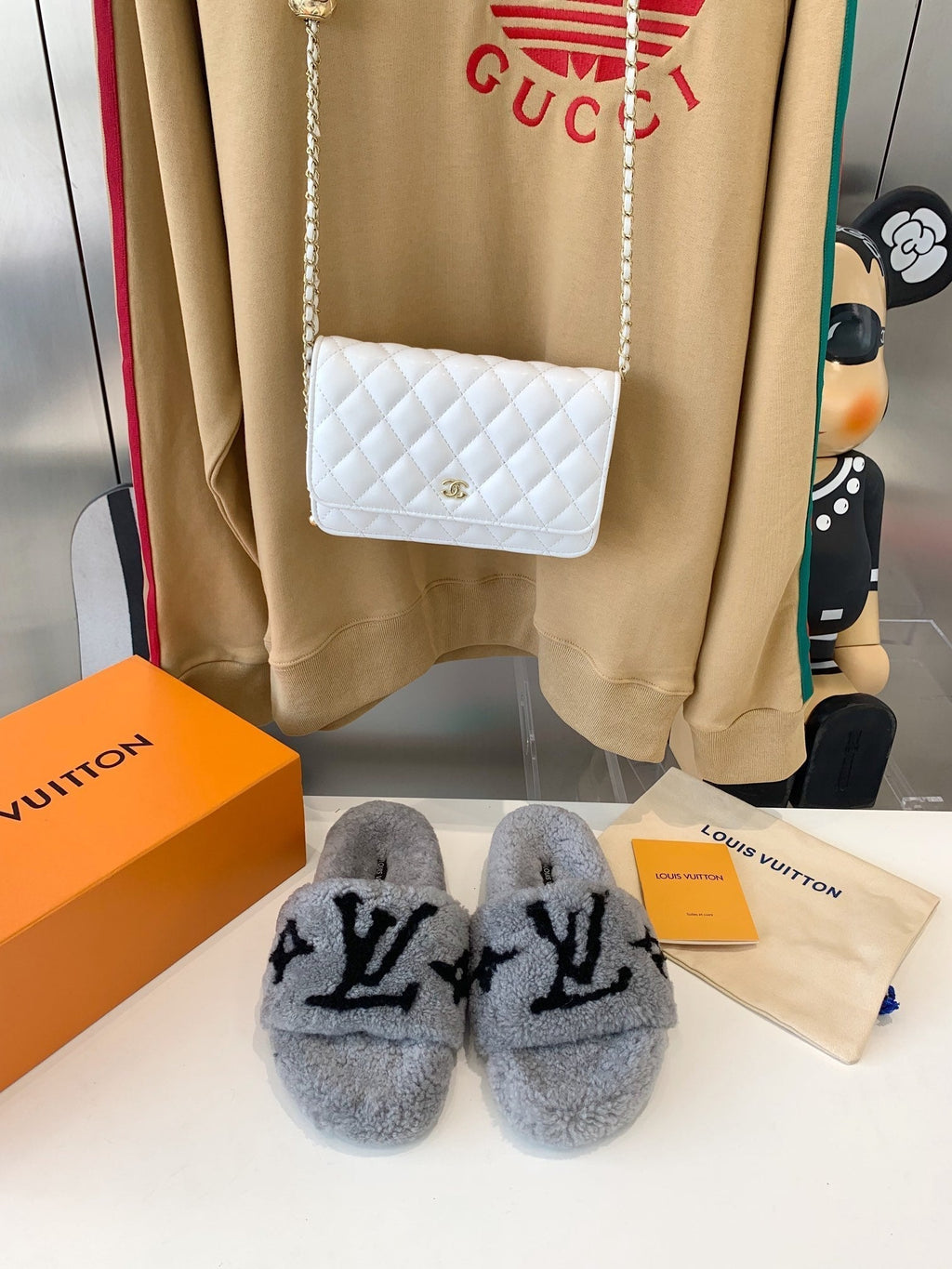 LOUIS VUITTON LV WOMEN'S PASEO FLAT SLIPPER IN GREY FLEECE WITH BLACK LOGO