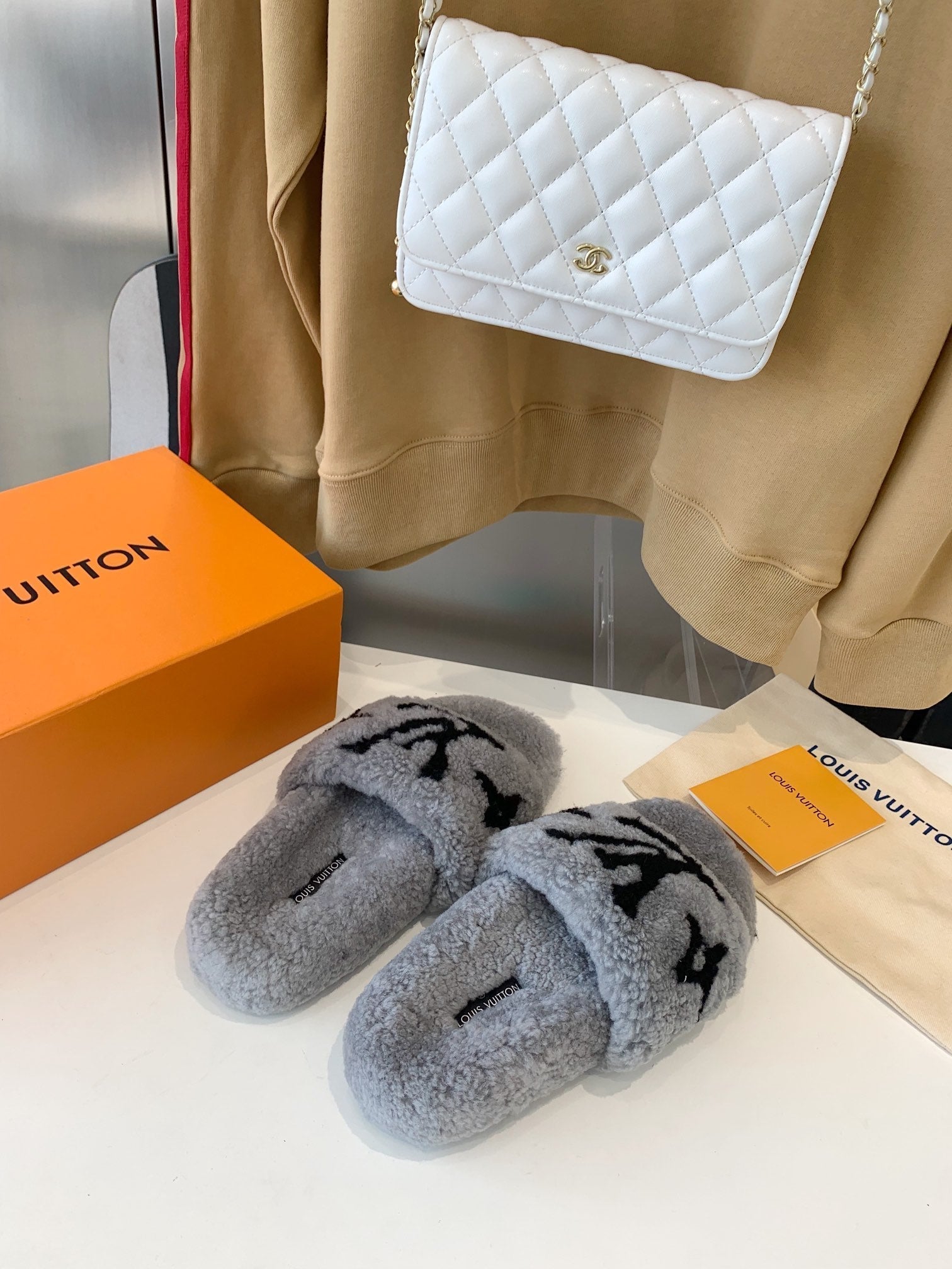 LOUIS VUITTON LV WOMEN'S PASEO FLAT SLIPPER IN GREY FLEECE WITH BLACK LOGO