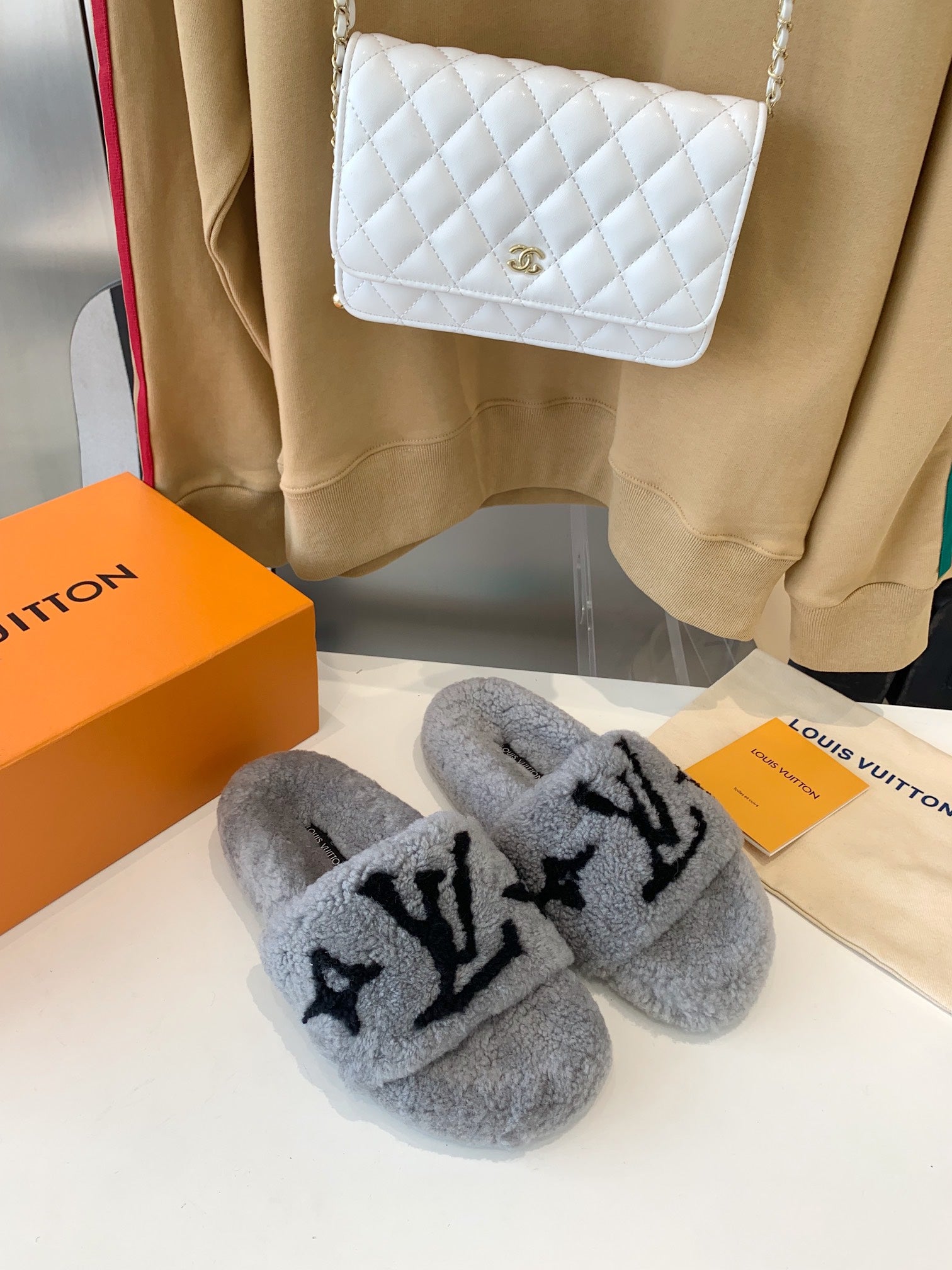 LOUIS VUITTON LV WOMEN'S PASEO FLAT SLIPPER IN GREY FLEECE WITH BLACK LOGO
