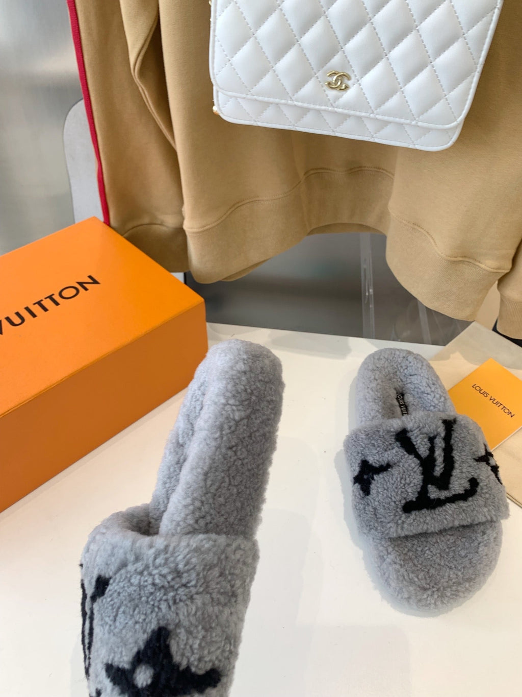 LOUIS VUITTON LV WOMEN'S PASEO FLAT SLIPPER IN GREY FLEECE WITH BLACK LOGO