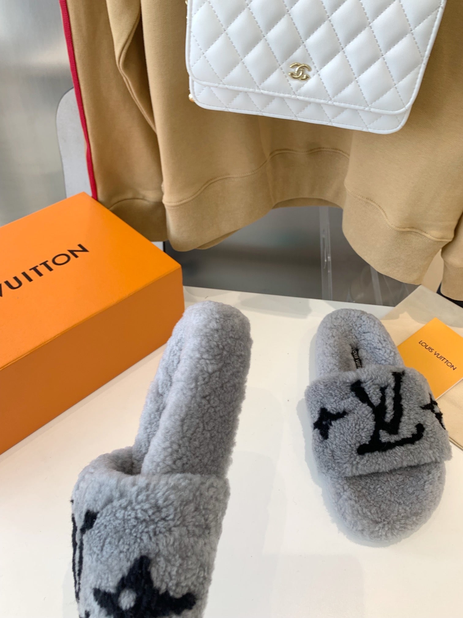 LOUIS VUITTON LV WOMEN'S PASEO FLAT SLIPPER IN GREY FLEECE WITH BLACK LOGO