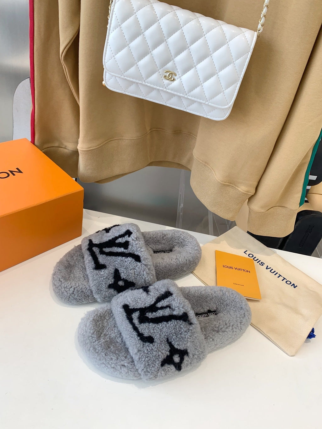 LOUIS VUITTON LV WOMEN'S PASEO FLAT SLIPPER IN GREY FLEECE WITH BLACK LOGO