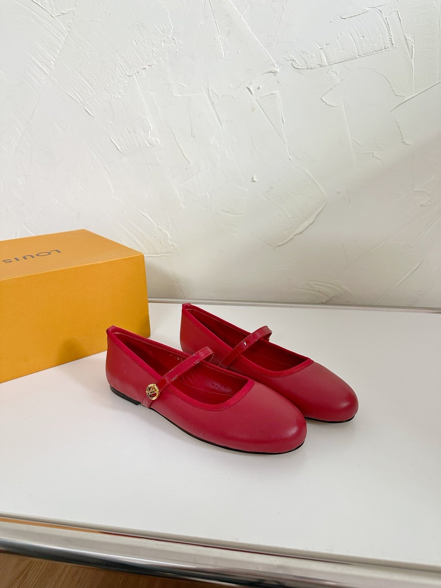 LOUIS VUITTON ROMY FLAT BALLERINA IN RUBY RED CALFSKIN