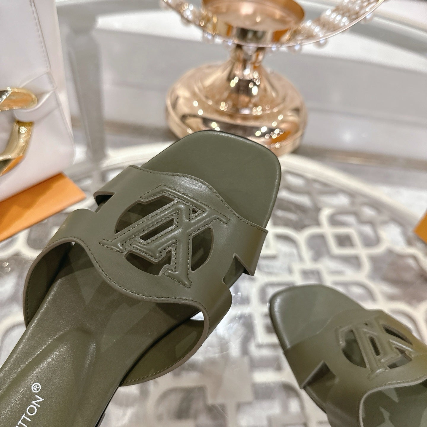LOUIS VUITTON ISOLA FLAT SLIDE IN ARMY GREEN CALFSKIN