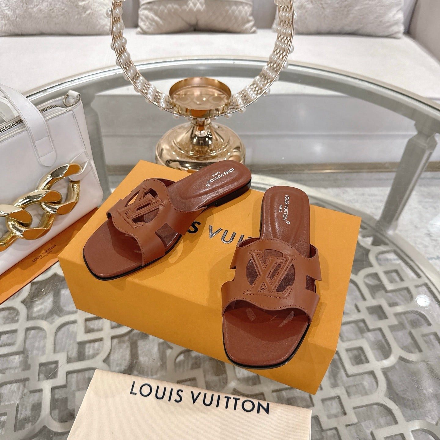 LOUIS VUITTON ISOLA FLAT SLIDE IN PENNY BROWN CALFSKIN