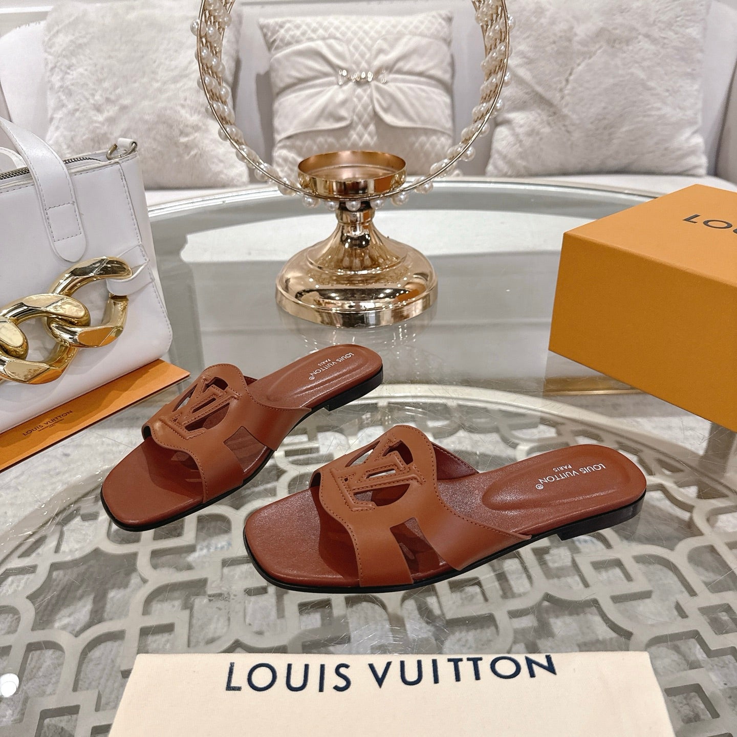 LOUIS VUITTON ISOLA FLAT SLIDE IN PENNY BROWN CALFSKIN