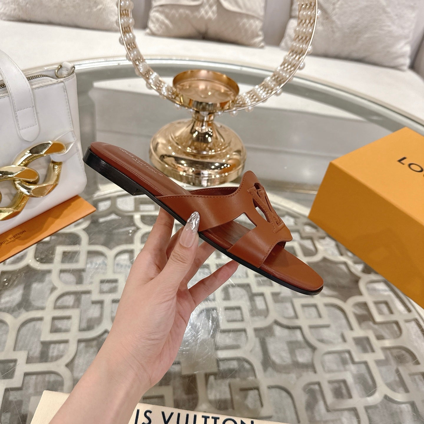 LOUIS VUITTON ISOLA FLAT SLIDE IN PENNY BROWN CALFSKIN