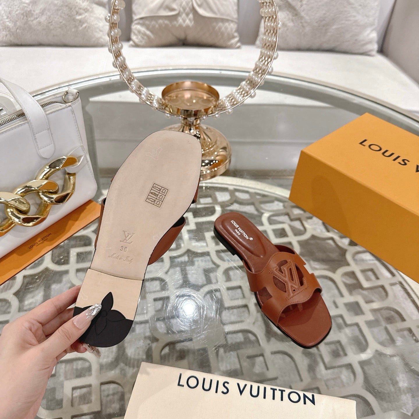 LOUIS VUITTON ISOLA FLAT SLIDE IN PENNY BROWN CALFSKIN