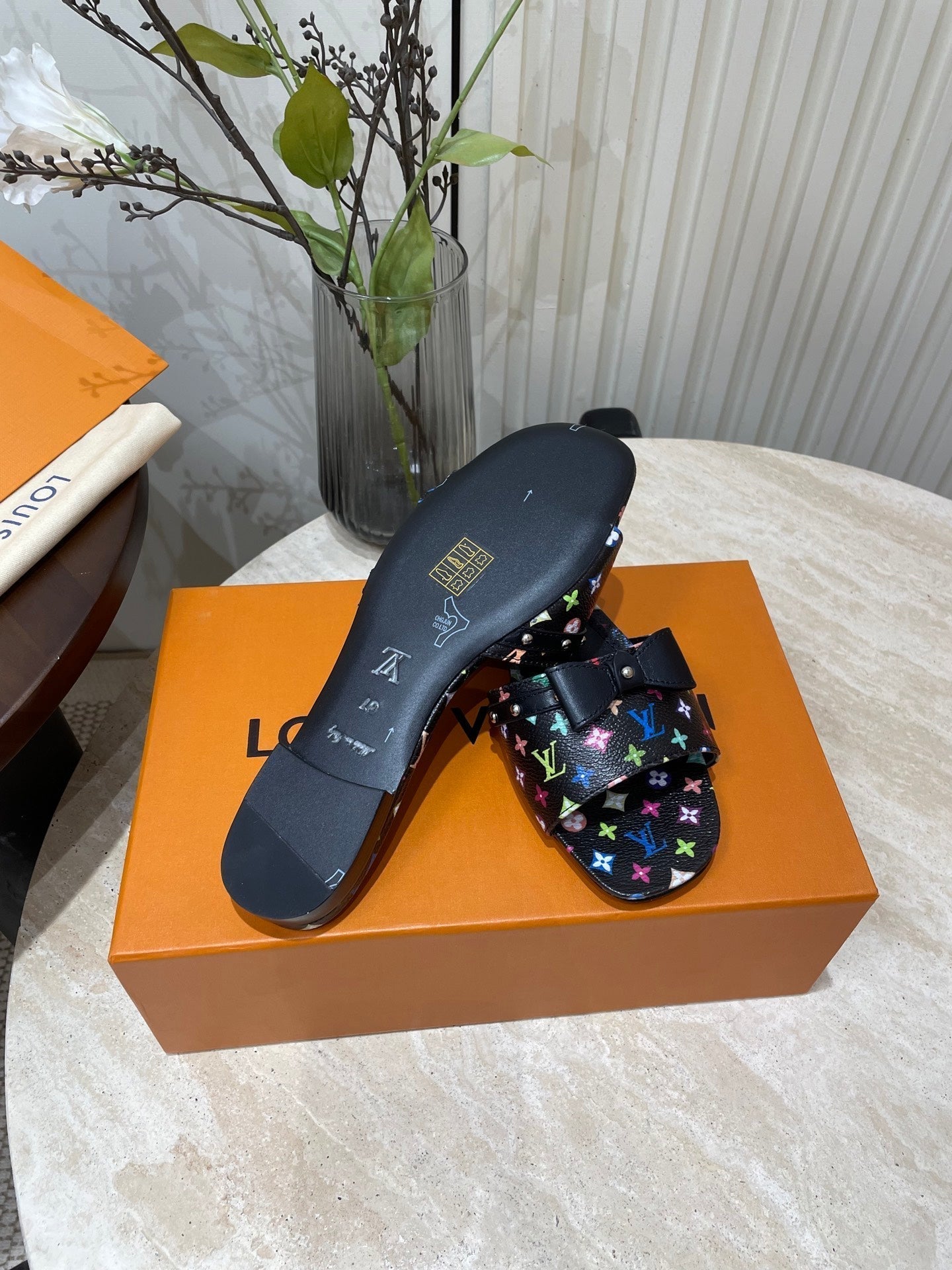 LOUIS VUITTON BOW FLAT MULES IN BLACK MONOGRAM LAMBSKIN