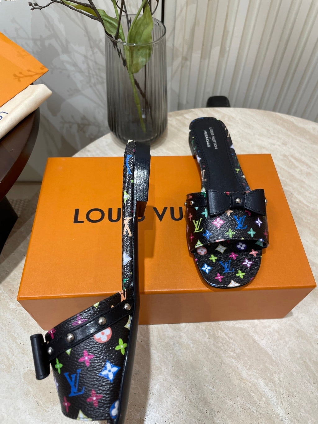 LOUIS VUITTON BOW FLAT MULES IN BLACK MONOGRAM LAMBSKIN