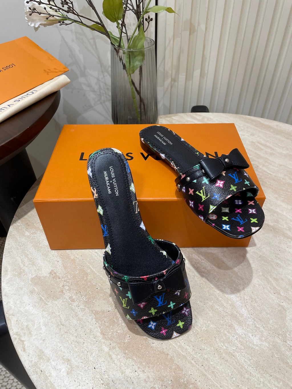 LOUIS VUITTON BOW FLAT MULES IN BLACK MONOGRAM LAMBSKIN