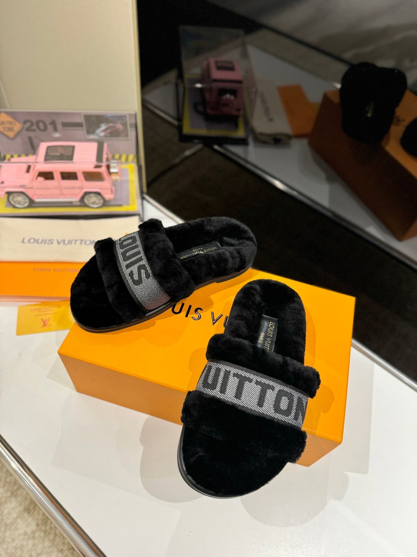 LOUIS VUITTON FURRY SLIPPER IN BLACK SHEARLING